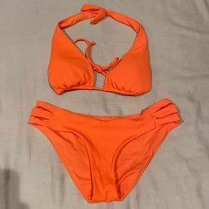 Becca 2 pice bikini.  Both top and bottom size medium. Bright orange color.